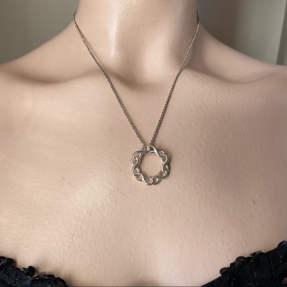 SAQ stamped women silver tone infinity twist circle pendant necklace. Used. - Picture 1 of 6